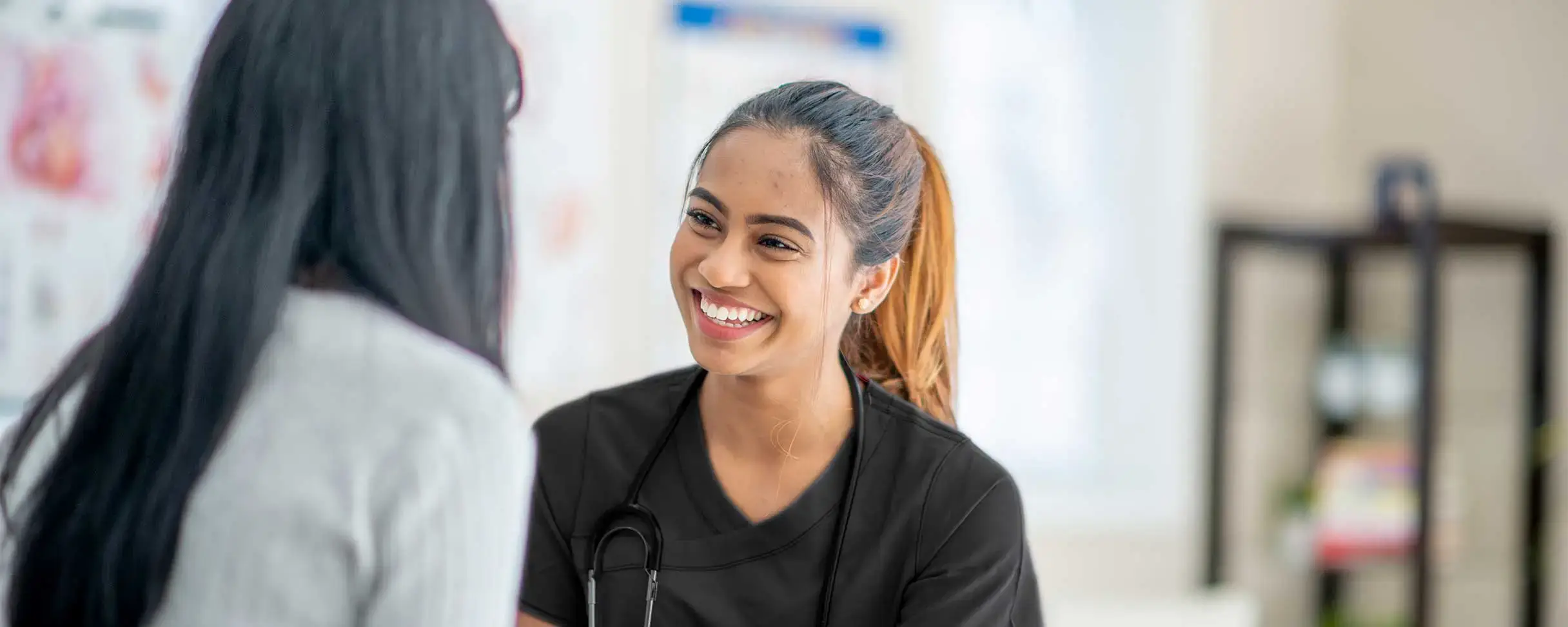 Medical professional engaging with patients in a workplace