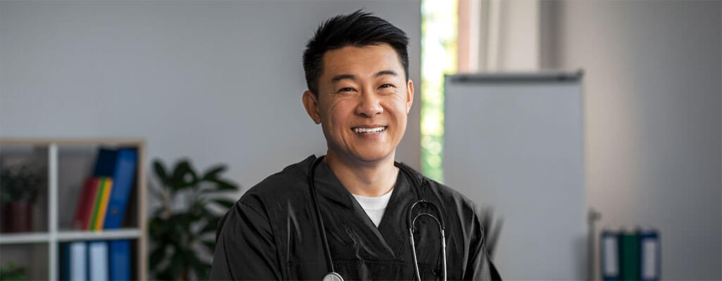 Male nurse smiling at the camera