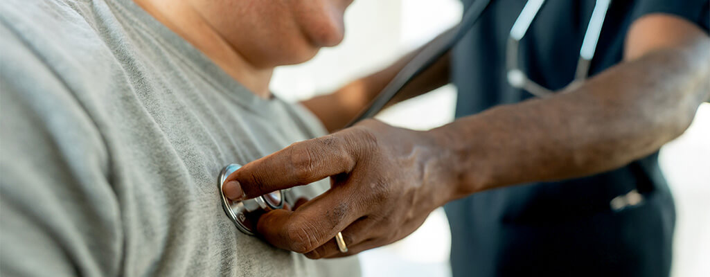 Nurse checking patient's vitals