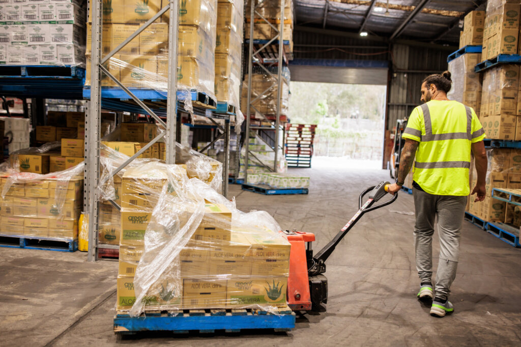 warehouse worker loading dock pallets