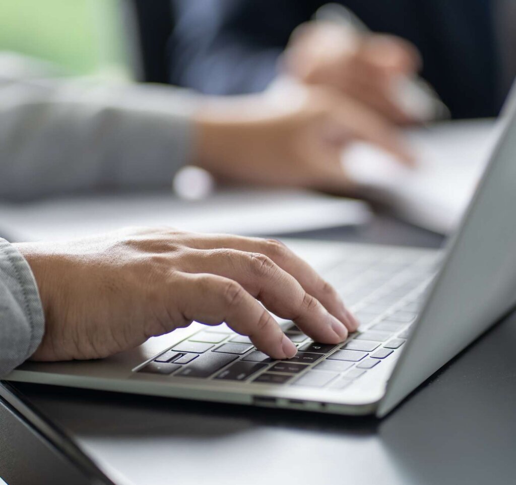 LaunchPoint workplace health services employee working on laptop