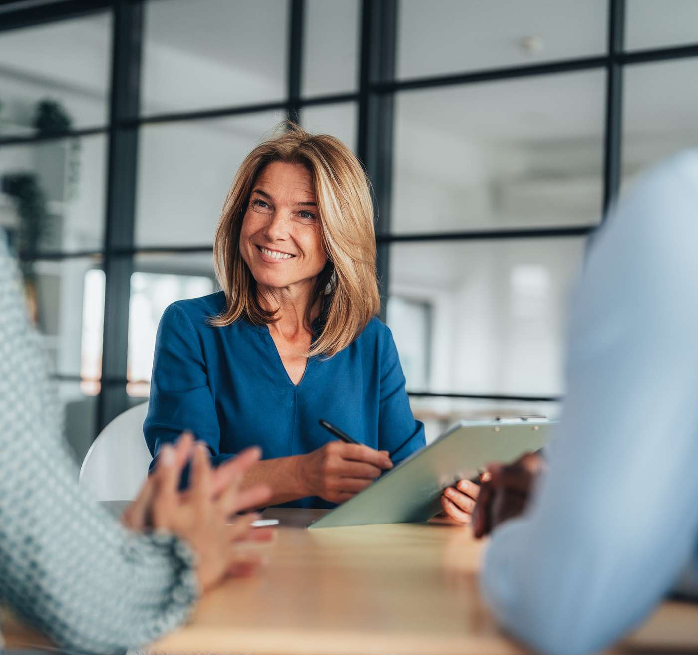 LaunchPoint onsite health manager reviewing notes with employees