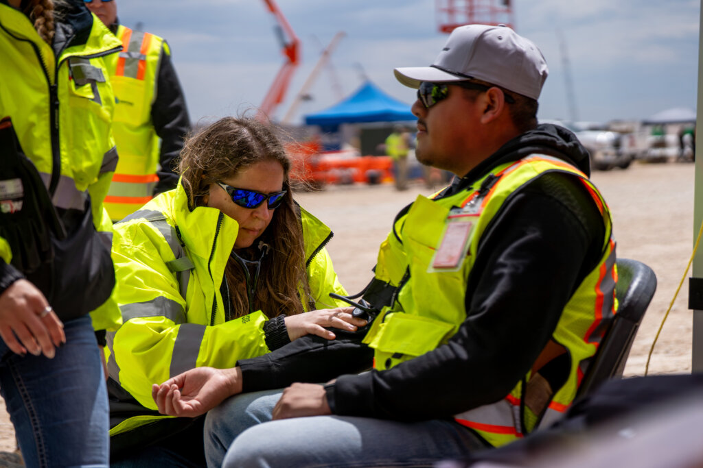 Medcor Canada clinic occupational health professional assessing worker at outdoor construction site